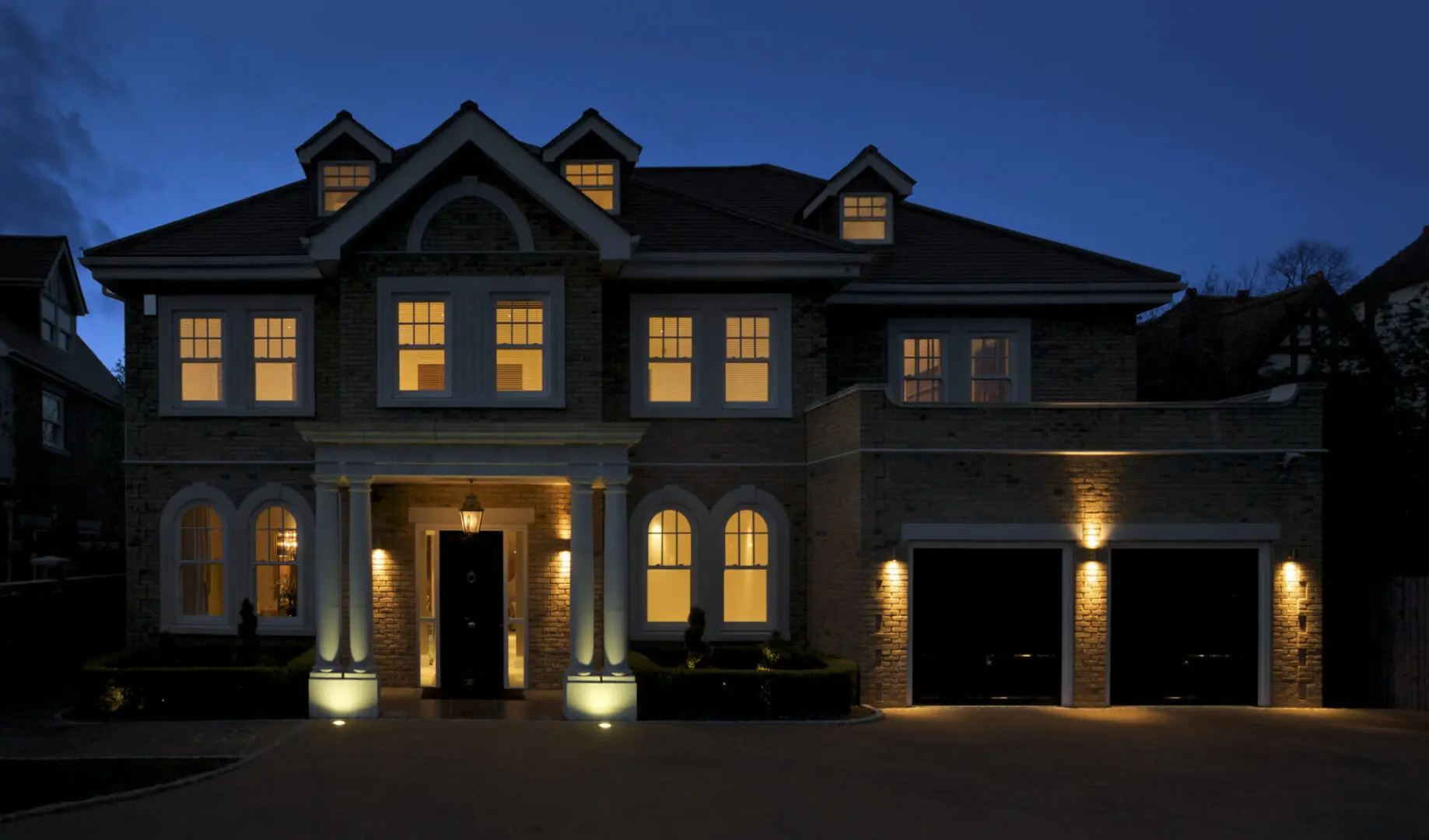 Illuminated house exterior at night.