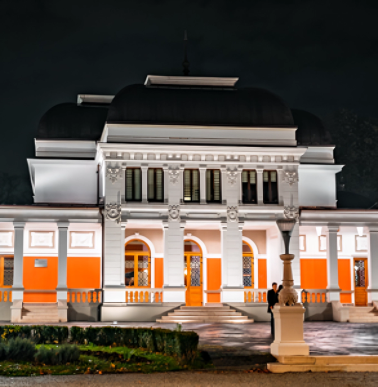 Illuminated historic building at night.