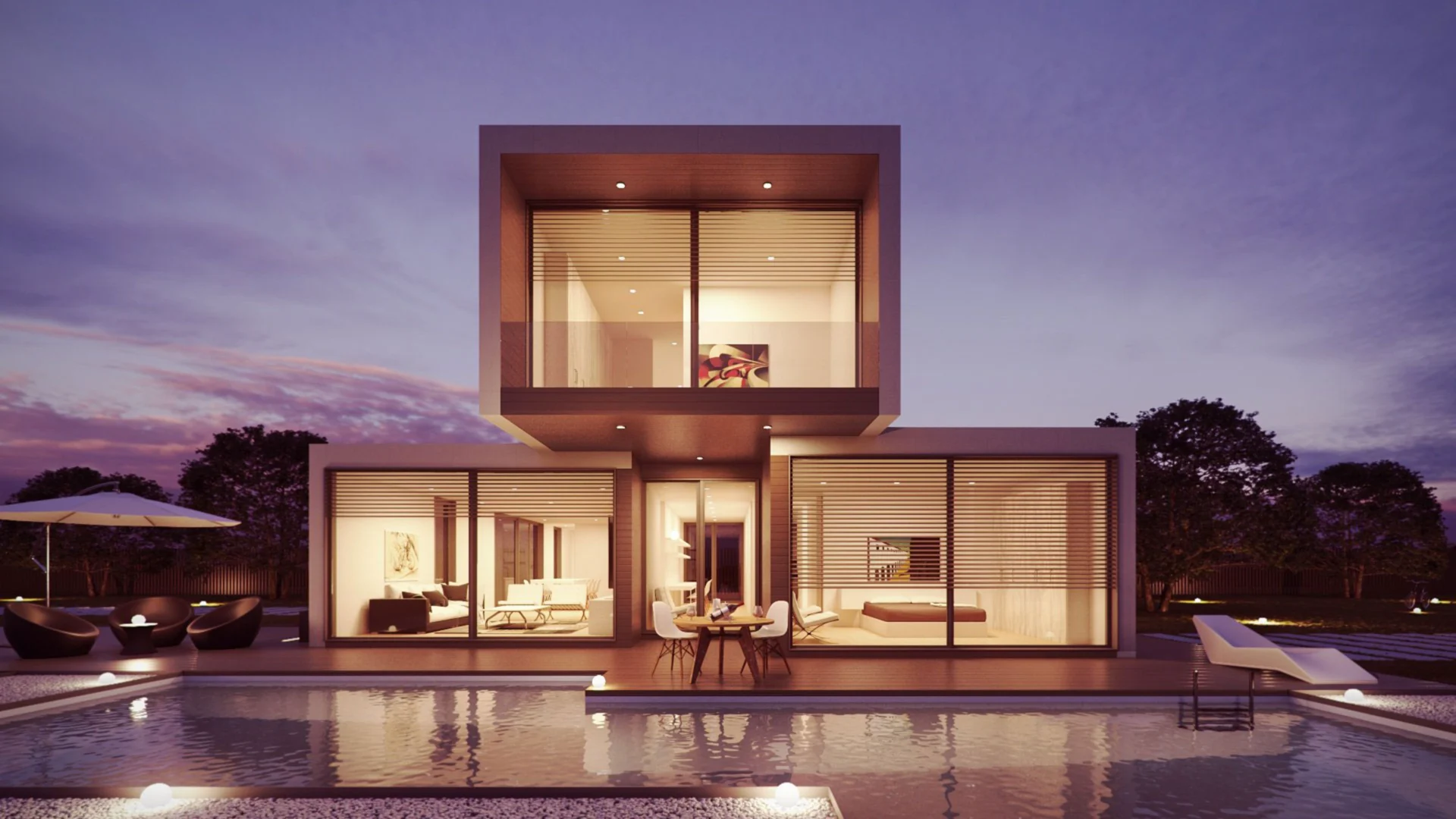 Modern house exterior with pool at dusk.